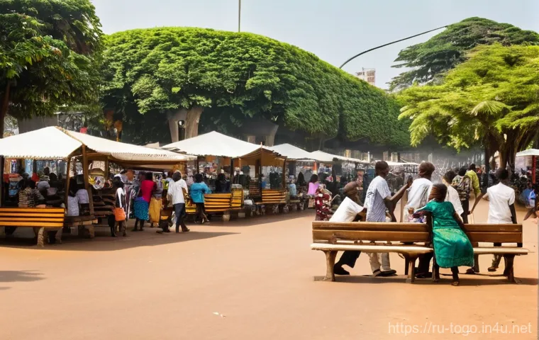 토고 독립광장 역사 - **Prompt:** "A grand, cinematic shot of the Independence Monument in Lomé, Togo, at the golden hour....