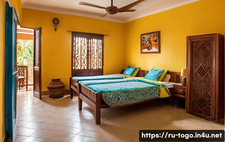 토고의 저렴한 게스트하우스 - A cozy guesthouse in Lomé, Togo, showcasing a welcoming local family atmosphere with traditional Tog...